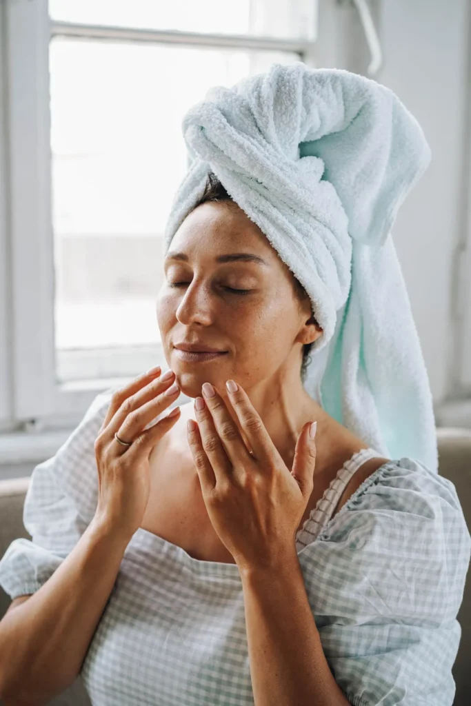 Woman with healthy glowing skin showing improved hydration and smoother complexion after skin booster treatment