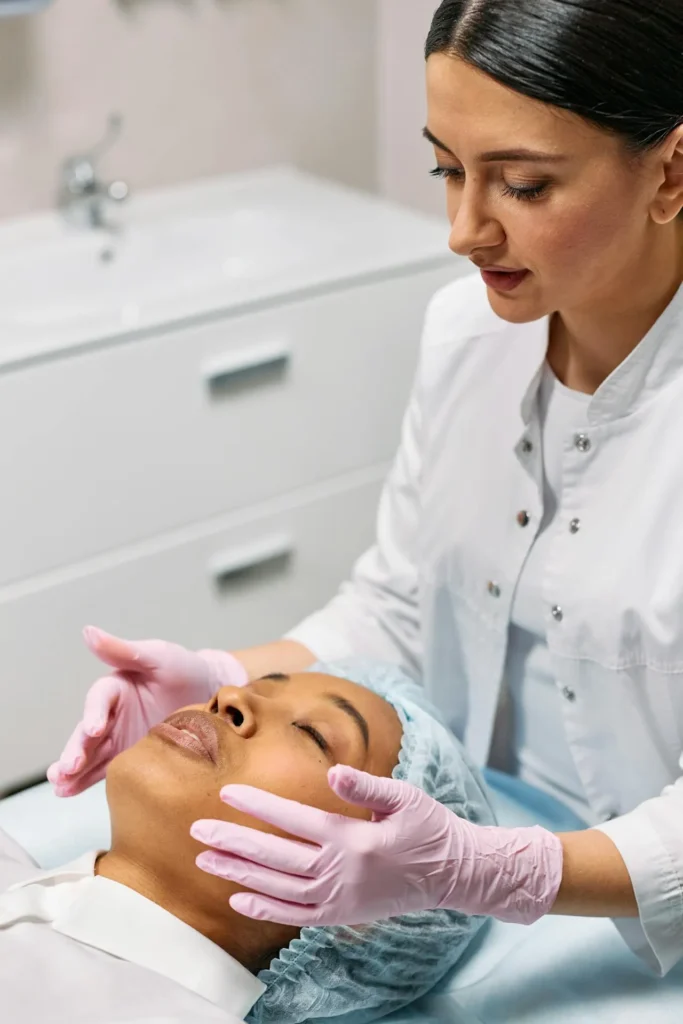 Qualified aesthetic practitioner performing a botox injection using sterile technique in a regulated clinic environment.