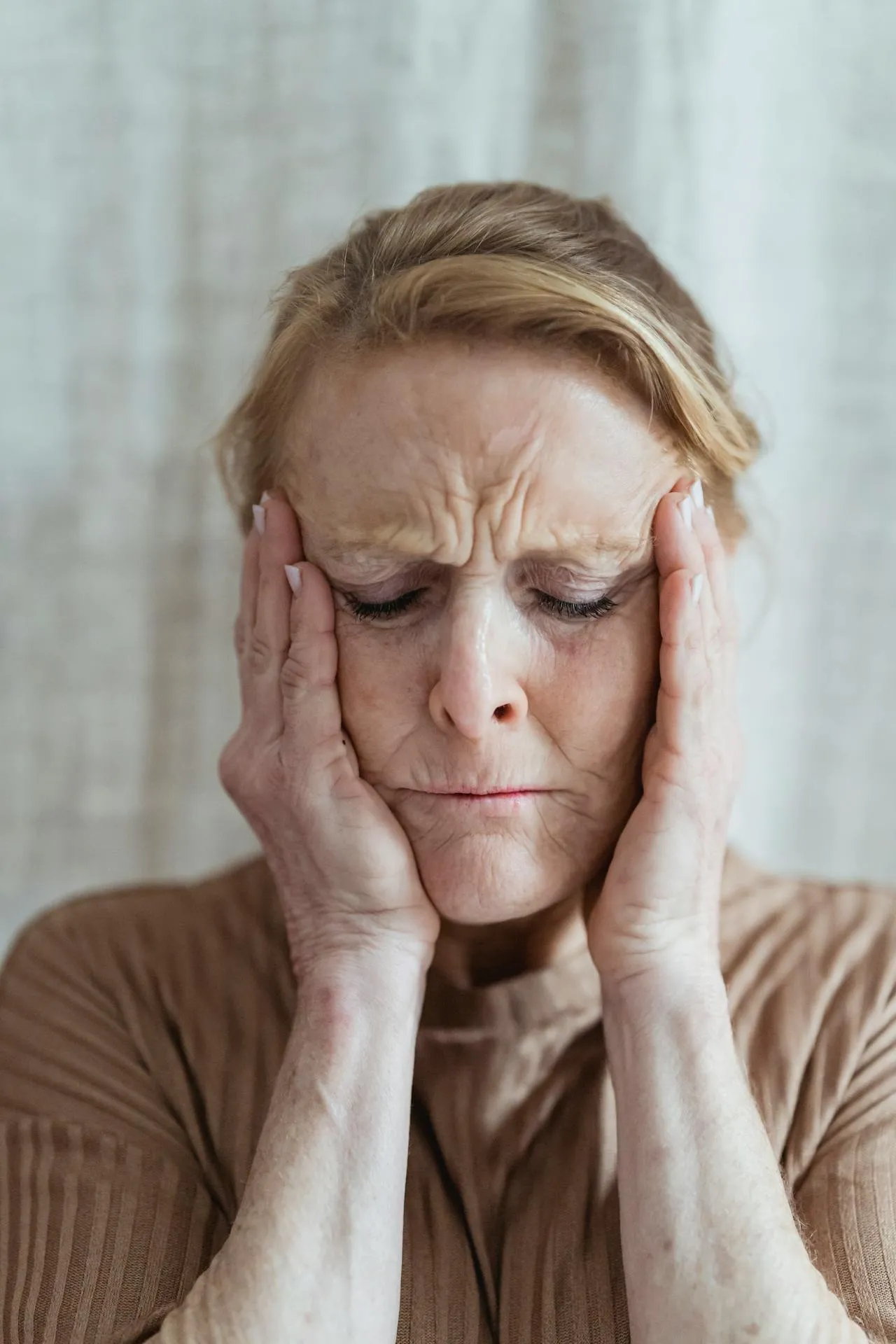 Woman showing deep wrinkles on her face