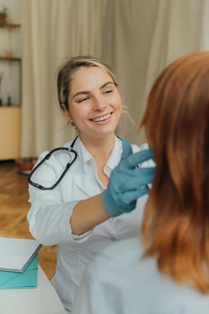 Cosmetic practitioner consulting with patient about factors that influence dermal filler longevity.