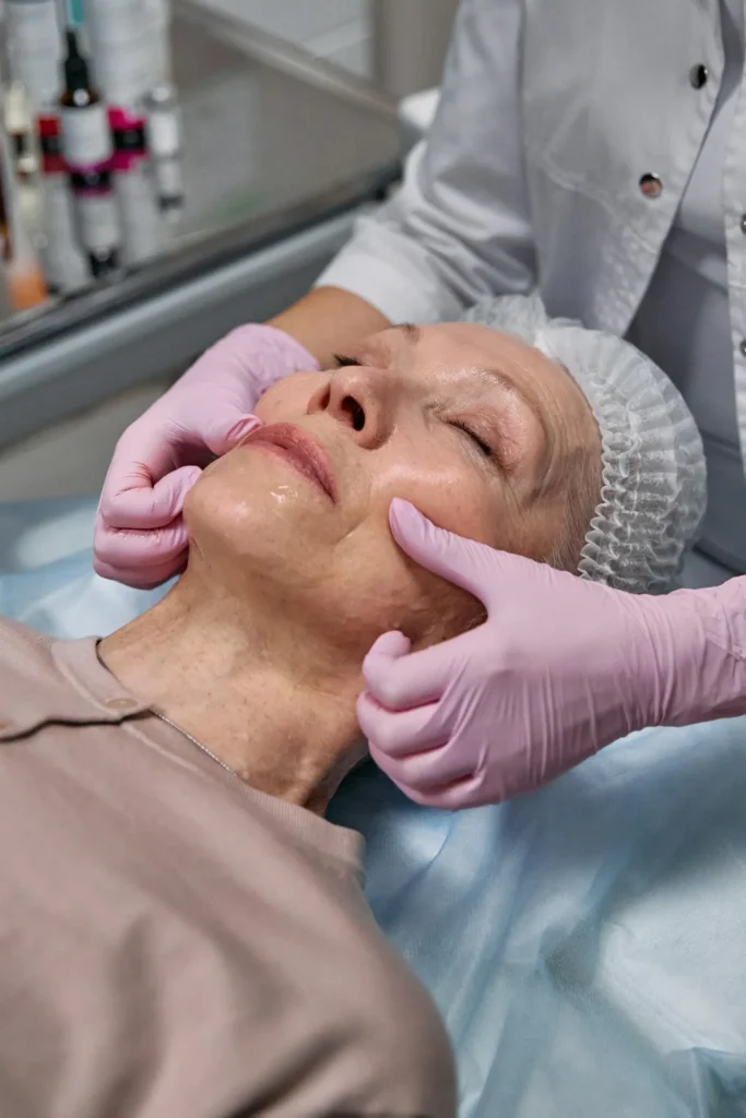 Cosmetic practitioner assessing deep facial lines before Botox treatment in an adult patient
