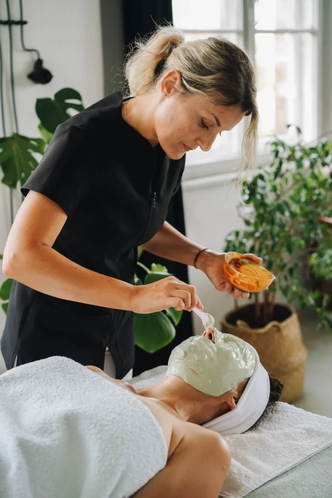 Young adult receiving a non-invasive cosmetic treatment at a dermatology clinic