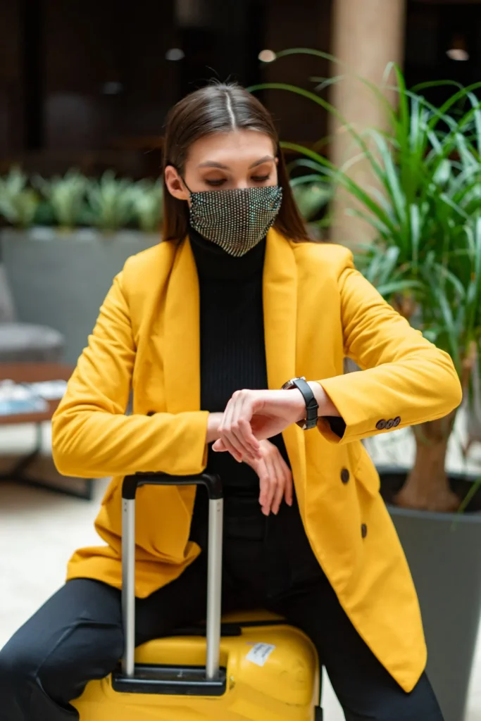 Female patient checking travel schedule after dermal filler treatment while consulting recovery guidelines