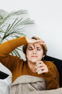 Patient thinking about non-surgical rhinoplasty and potential nose filler risks.