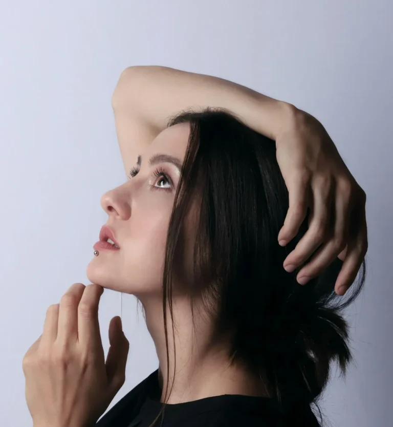 Side profile of a woman with a well-defined jawline following filler treatment